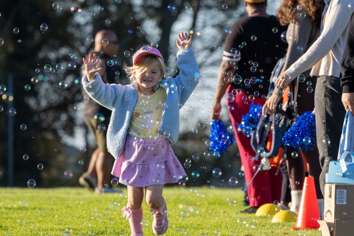 Young runner sprinting at a school jogathon