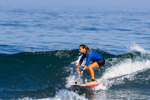 Late afternoon surf spray frozen mid-air